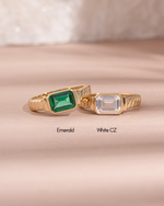baguette cut statement ring in emerald cubic zirconia and white cubic zirconia side by side 