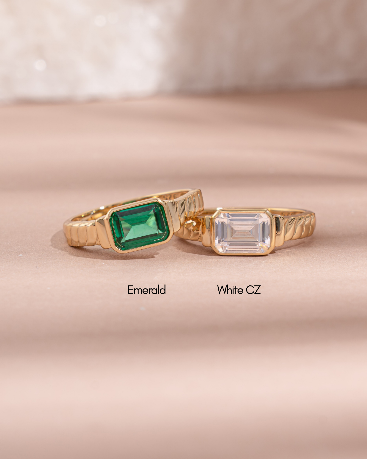 baguette cut statement ring in emerald cubic zirconia and white cubic zirconia side by side 
