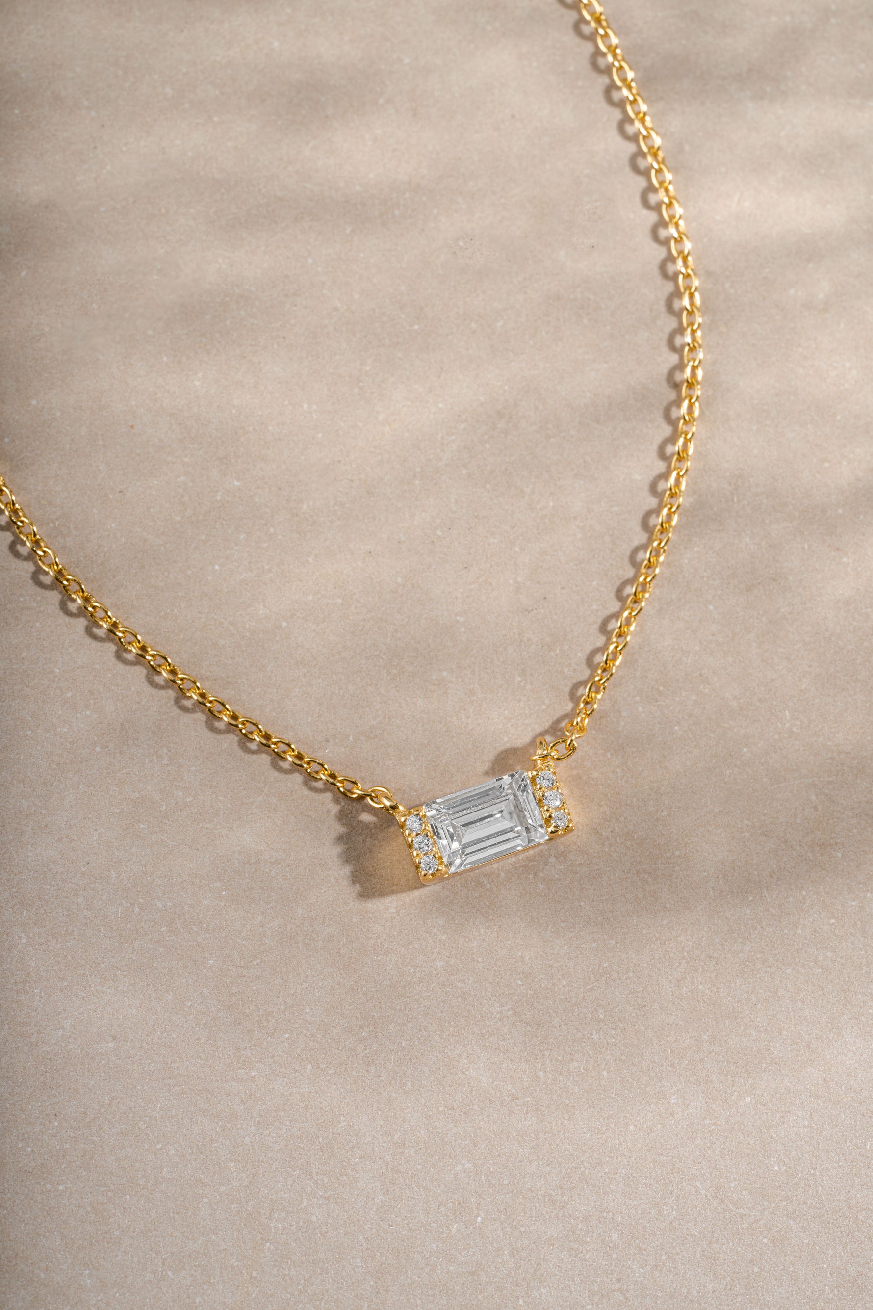 Close-up of Sami Jewels gold baguette diamond necklace highlighting the elegant baguette-cut diamonds and fine craftsmanship.