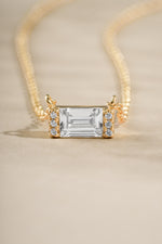 Gold Baguette Diamond Necklace by Sami Jewels featuring a sleek baguette-cut diamond and elegant stone details.