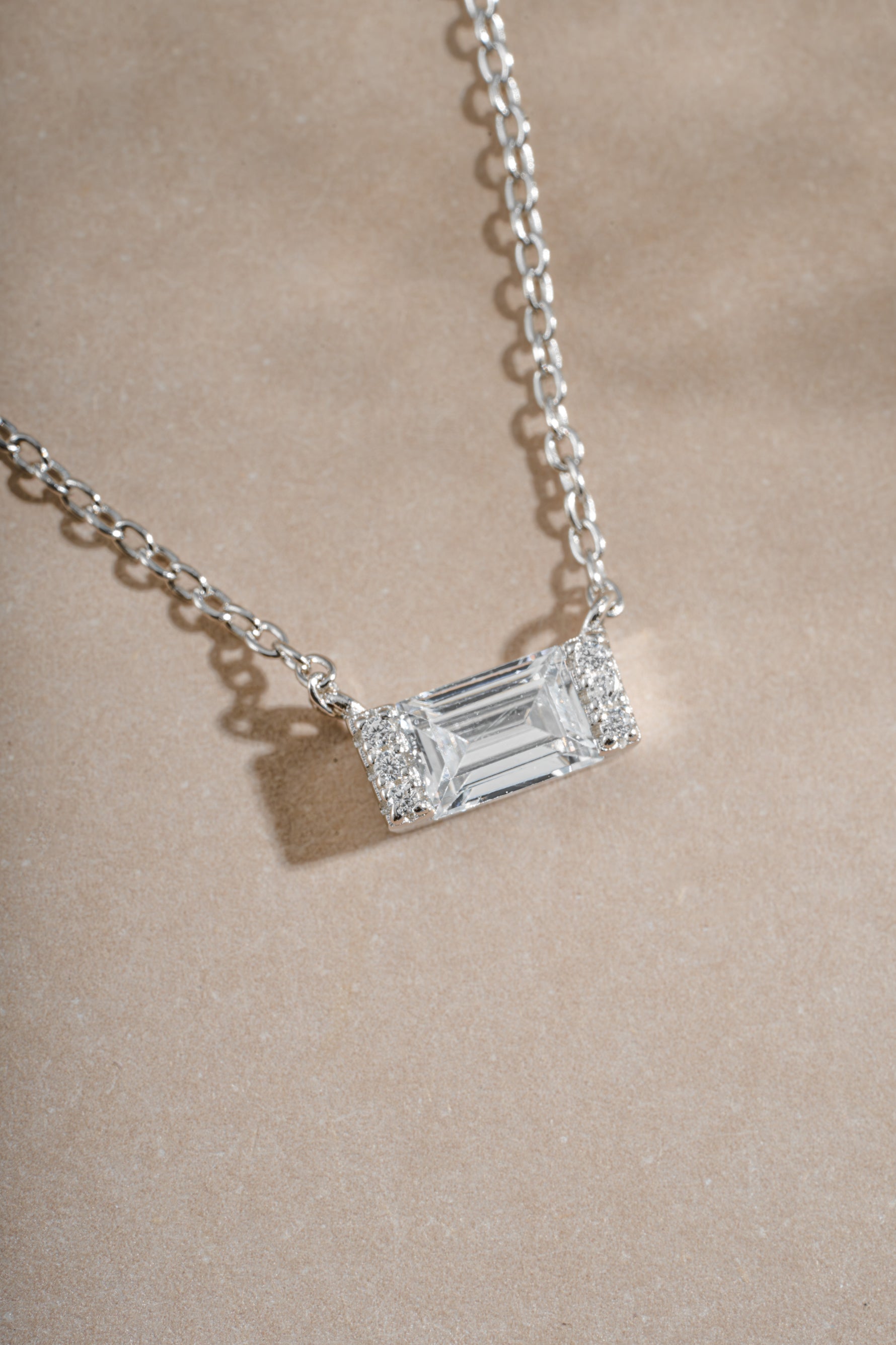 Sterling silver Baguette Necklace by Sami Jewels featuring a baguette diamond pendant with stone detail.