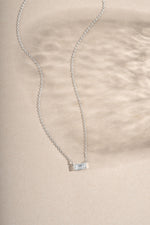 Sterling silver baguette diamond necklace by Sami Jewels featuring a sleek, elegant design with sparkling baguette-cut diamonds.