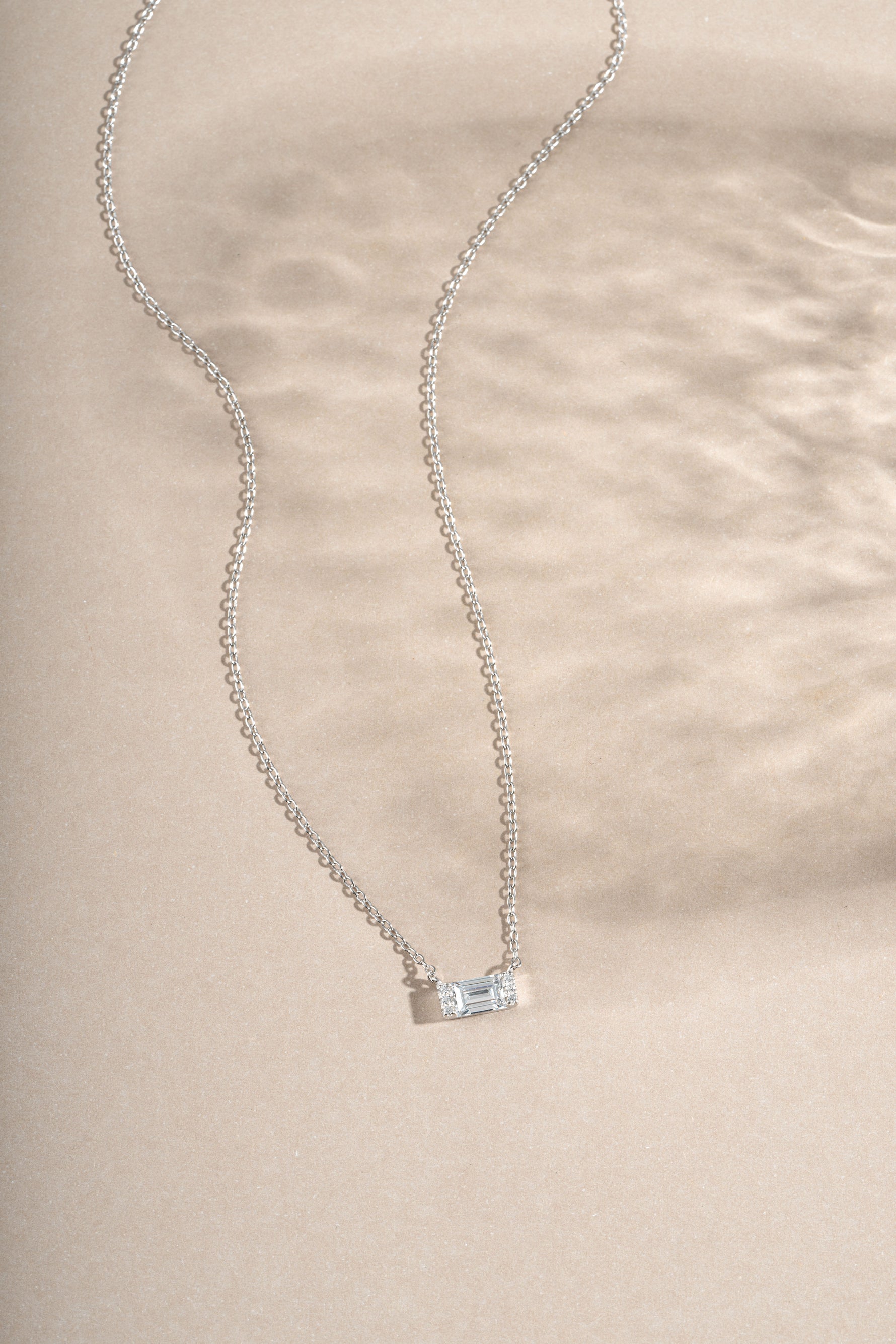 Sterling silver baguette diamond necklace by Sami Jewels featuring a sleek, elegant design with sparkling baguette-cut diamonds.