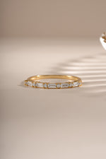 Gold baguette diamond stacking ring by Sami Jewels, front view showcasing sleek design and sparkling gemstones.