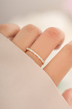Gold Baguette Diamond Stacking Ring from Sami Jewels, showcasing a sleek design with baguette-cut diamonds on a modern ring.