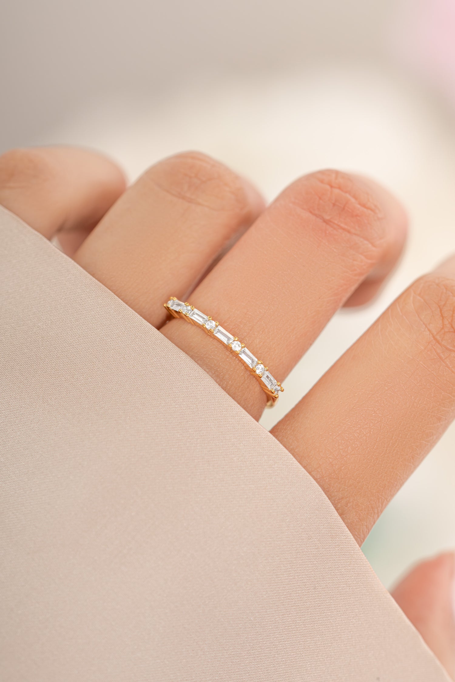 Gold Baguette Diamond Stacking Ring from Sami Jewels, showcasing a sleek design with baguette-cut diamonds on a modern ring.