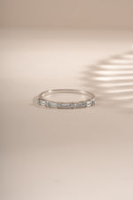 Sami Jewels Baguette Diamond Stacking Ring in sterling silver, featuring a row of baguette-cut diamonds on the front view.