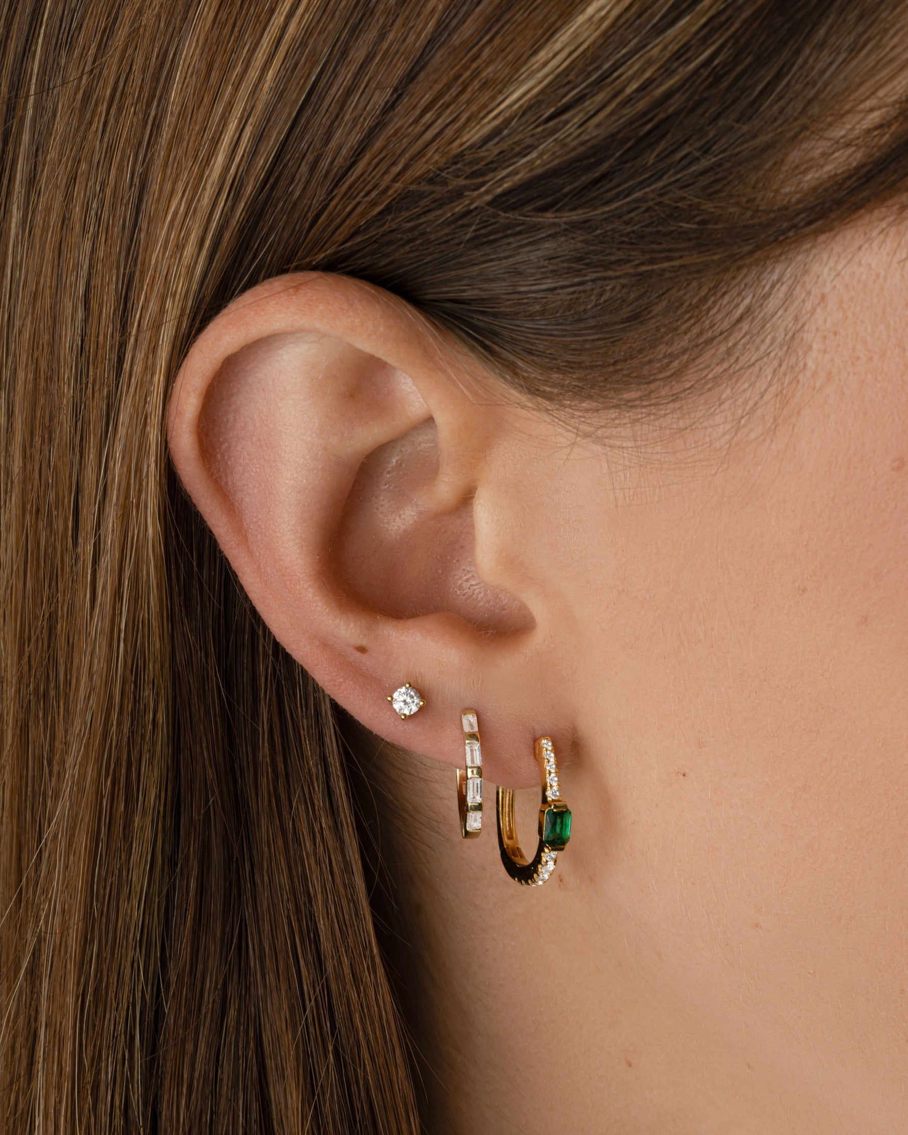 Gold Baguette Hoop Earrings by Sami Jewels displayed on a model, showcasing their elegant, elongated rectangular design.
