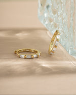 Sami Jewels baguette hoop earrings with stone detailing, featuring sleek gold hoops and rectangular gemstone accents.