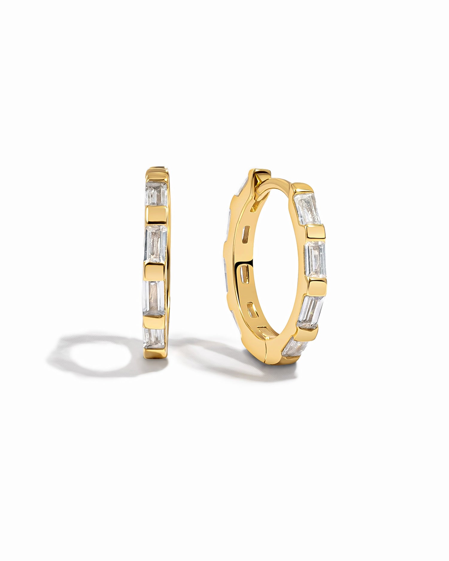 Gold baguette hoop earrings by Sami Jewels displayed against a white background, showcasing their sleek, rectangular design.