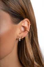 Gold Small Baguette Huggies earrings by Sami Jewels, featuring sleek baguette-cut gemstone accents on classic hoop design.