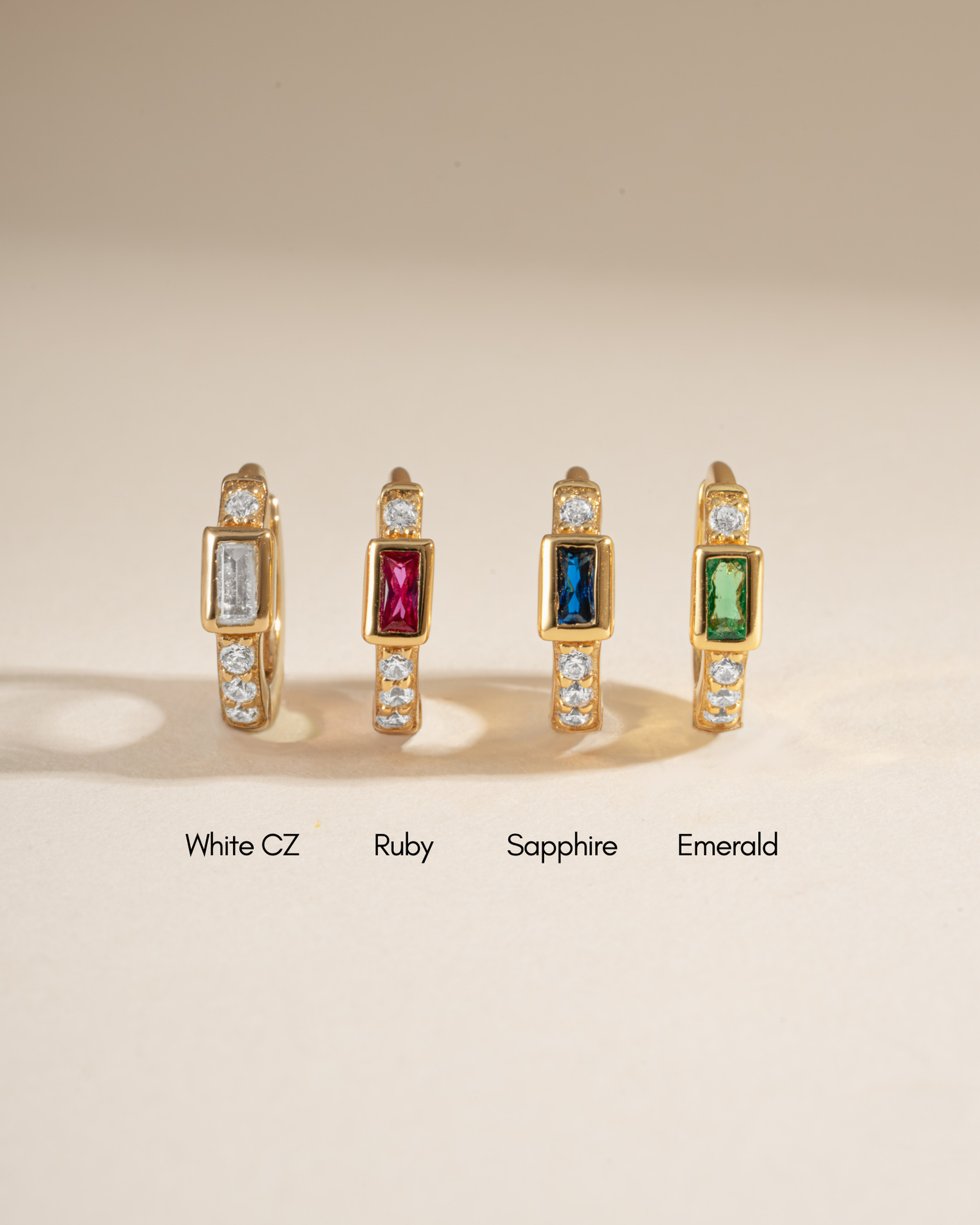 Sami Jewels Ruby Baguette Huggie Earrings with sparkling gemstone accents and sleek hoop design.