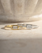 Gold and sterling silver baguette ring with pavé band by Sami Jewels, featuring sparkling gemstone accents.