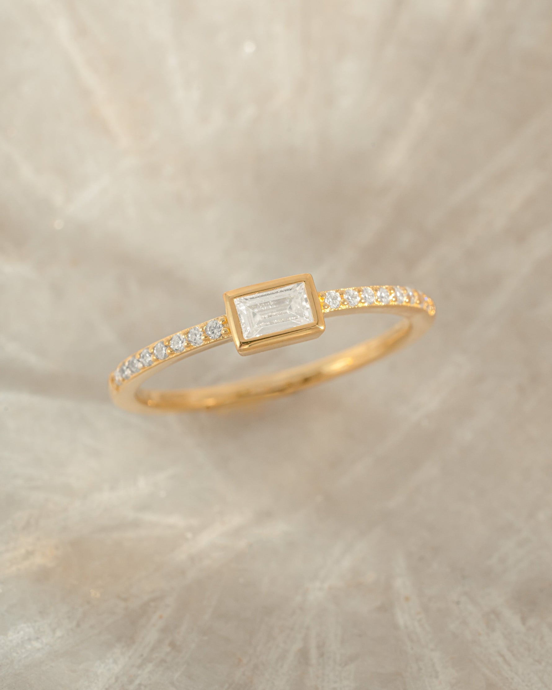 Gold Baguette Ring with Pavé band by Sami Jewels, close-up showing detailed baguette-cut stones and intricate band design.