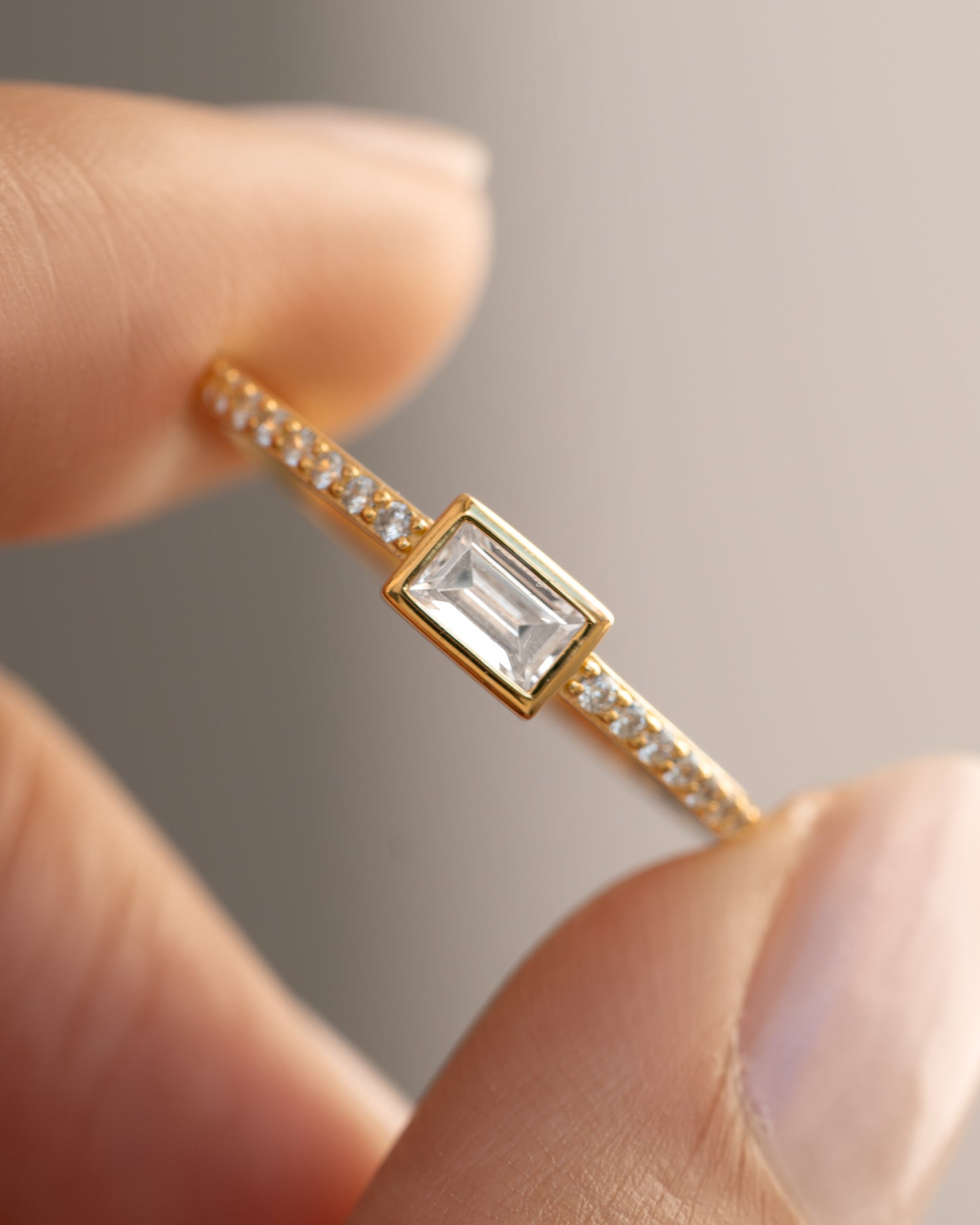 Gold Baguette Ring with pavé band and stone details from Samijewels-527, showcasing a sleek, elegant jewelry design.