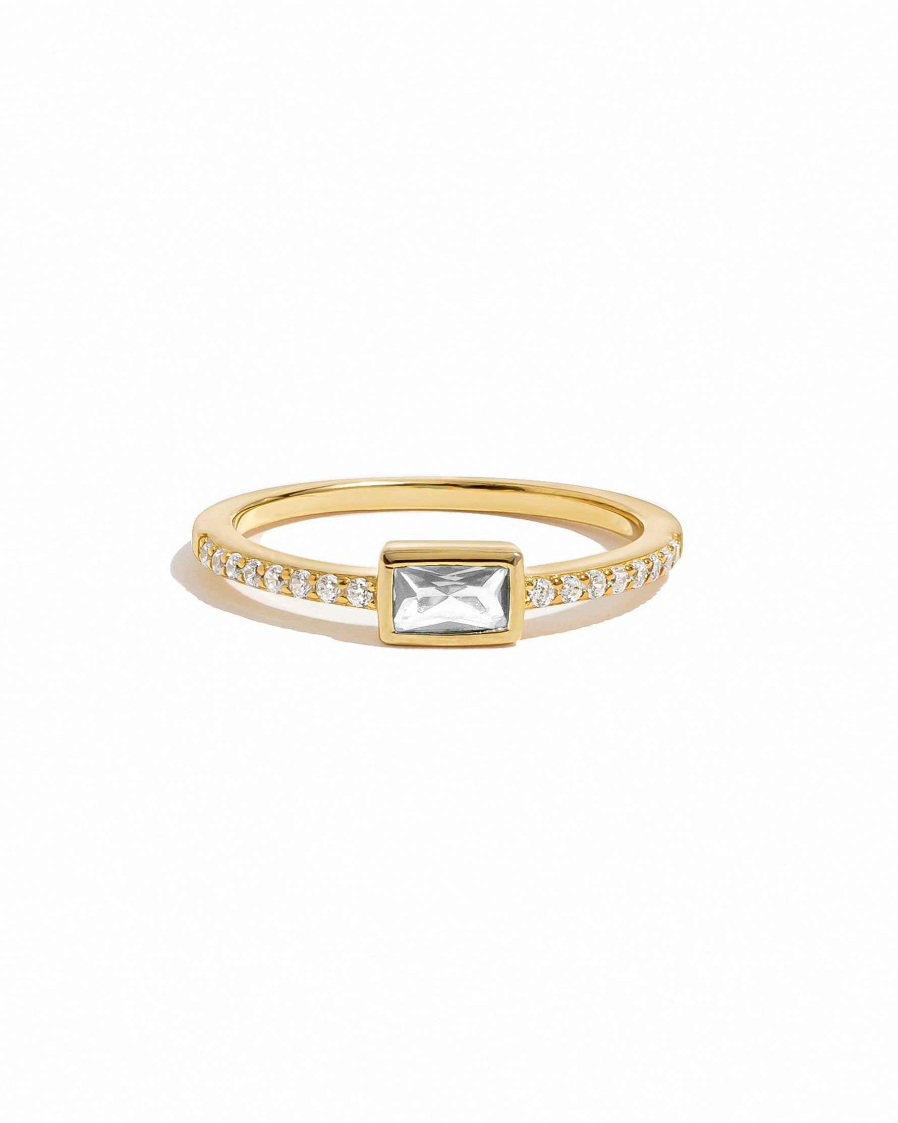 Baguette Ring w Pavé Band in gold on a white background