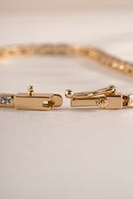 Sami Jewels Bezeled Baguette Tennis Bracelet with box clasp closure showcasing elegant rectangular gemstone settings.