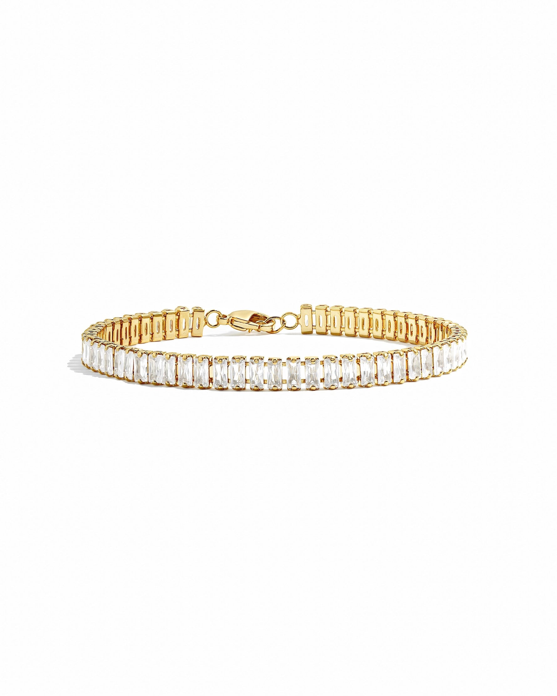 Gold Baguette Tennis Bracelet by Sami Jewels with rectangular cut gemstones displayed on a white background.