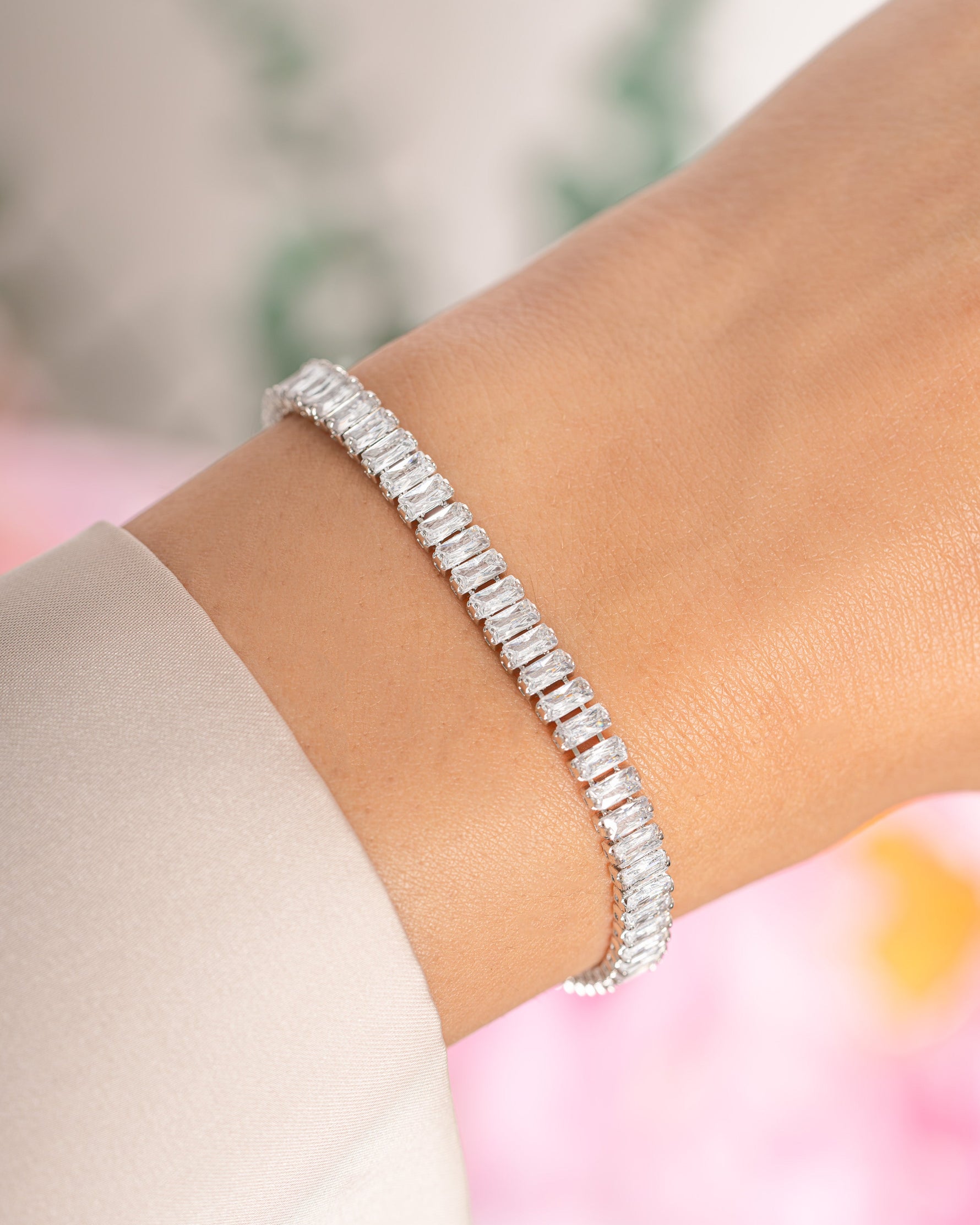 Silver Baguette Tennis Bracelet by Sami Jewels featuring a sleek row of baguette-cut stones on a delicate bracelet.