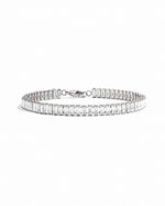 Silver Baguette Tennis Bracelet by Sami Jewels featuring a row of sparkling baguette-cut stones on a sleek bracelet design.