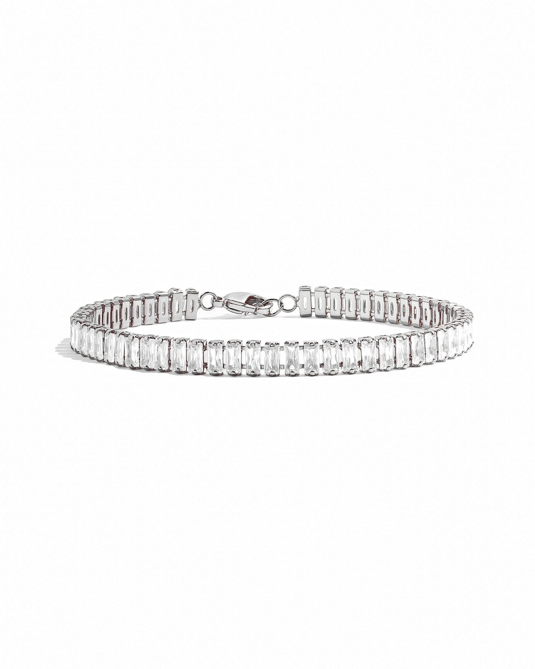 Silver Baguette Tennis Bracelet by Sami Jewels featuring a row of sparkling baguette-cut stones on a sleek bracelet design.