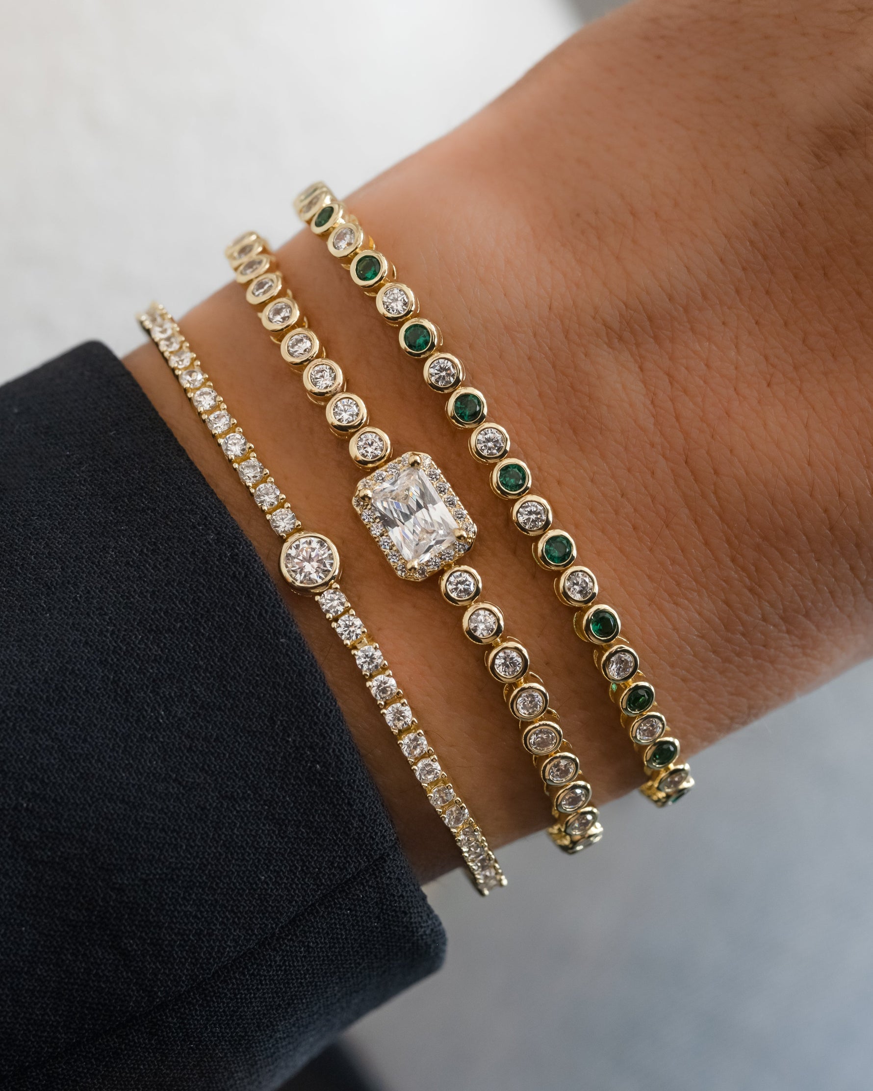 Gold CZ Baguette Rounded Tennis Bracelet by Sami Jewels featuring a sleek, stacked design with sparkling baguette-cut stones.