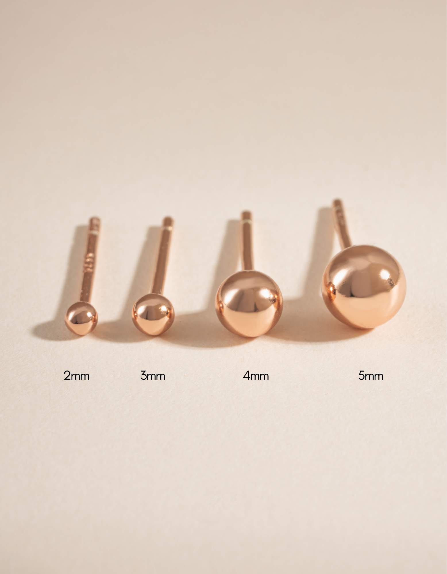 Rose gold 4mm ball stud earrings by Sami Jewels featuring sleek, minimalist spherical design for everyday wear.