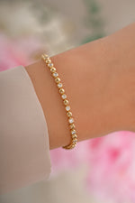 Gold Bead and Bezel Tennis Bracelet by Sami Jewels, featuring sparkling beads and bezel-set accents on a delicate bracelet.