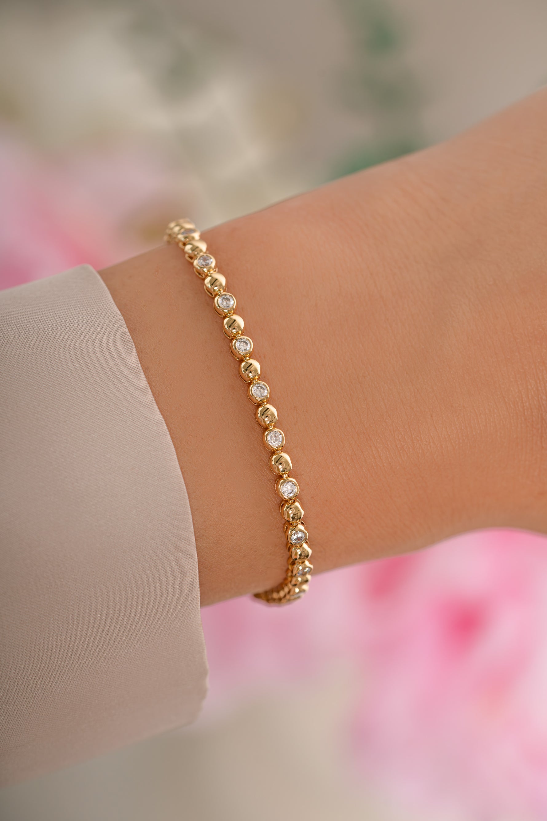 Gold Bead and Bezel Tennis Bracelet by Sami Jewels, featuring sparkling beads and bezel-set accents on a delicate bracelet.