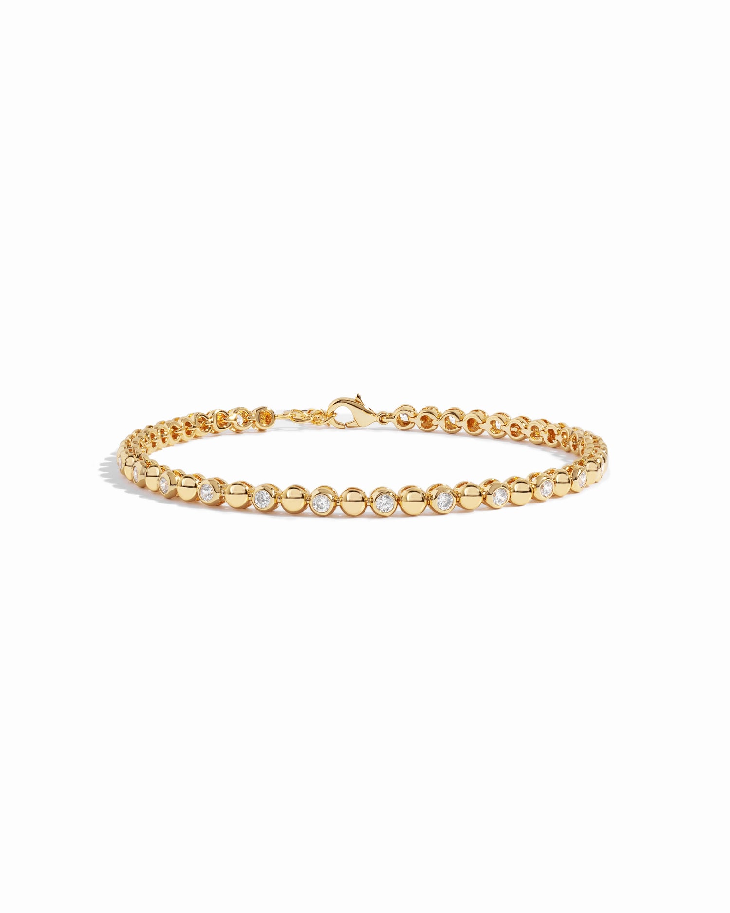 Gold Bead & Bezel Tennis Bracelet by Sami Jewels displayed on a white background, showcasing its elegant design and craftsmanship.
