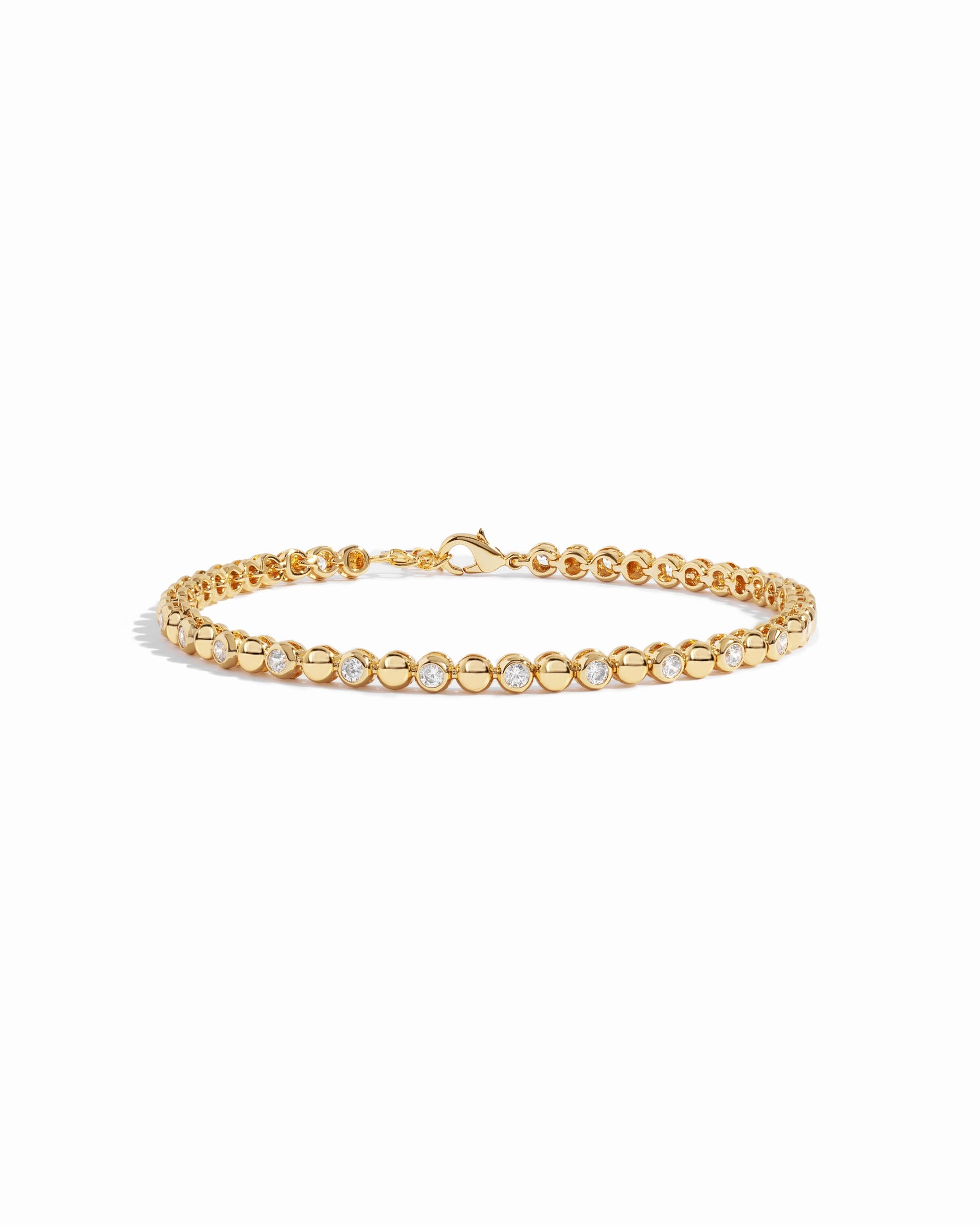Gold Bead & Bezel Tennis Bracelet by Sami Jewels displayed on a white background, showcasing its elegant design and craftsmanship.