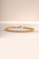 Gold bead and bezel tennis bracelet by Sami Jewels featuring a elegant design with sparkling beads and bezel-set accents.