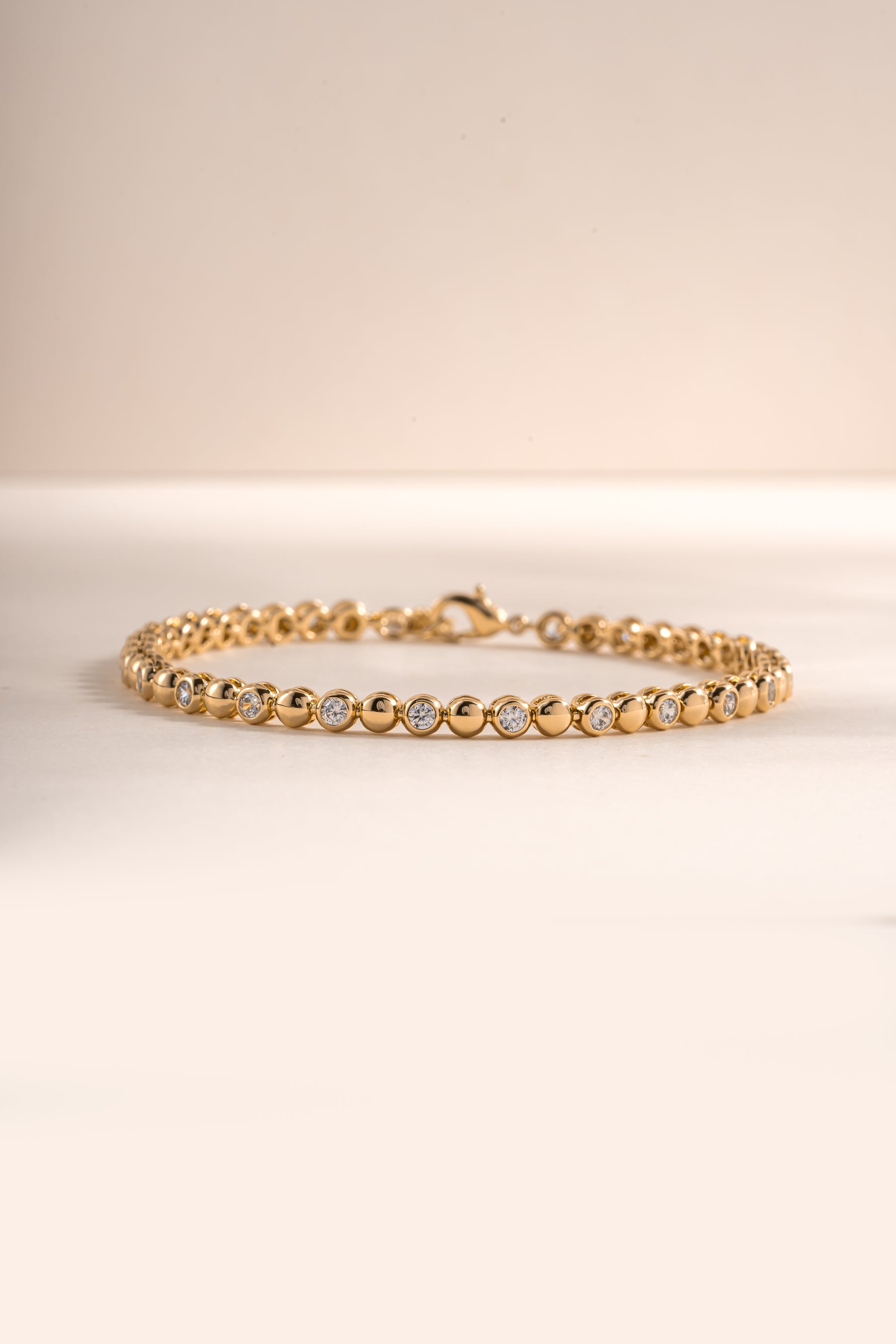 Gold bead and bezel tennis bracelet by Sami Jewels featuring a elegant design with sparkling beads and bezel-set accents.