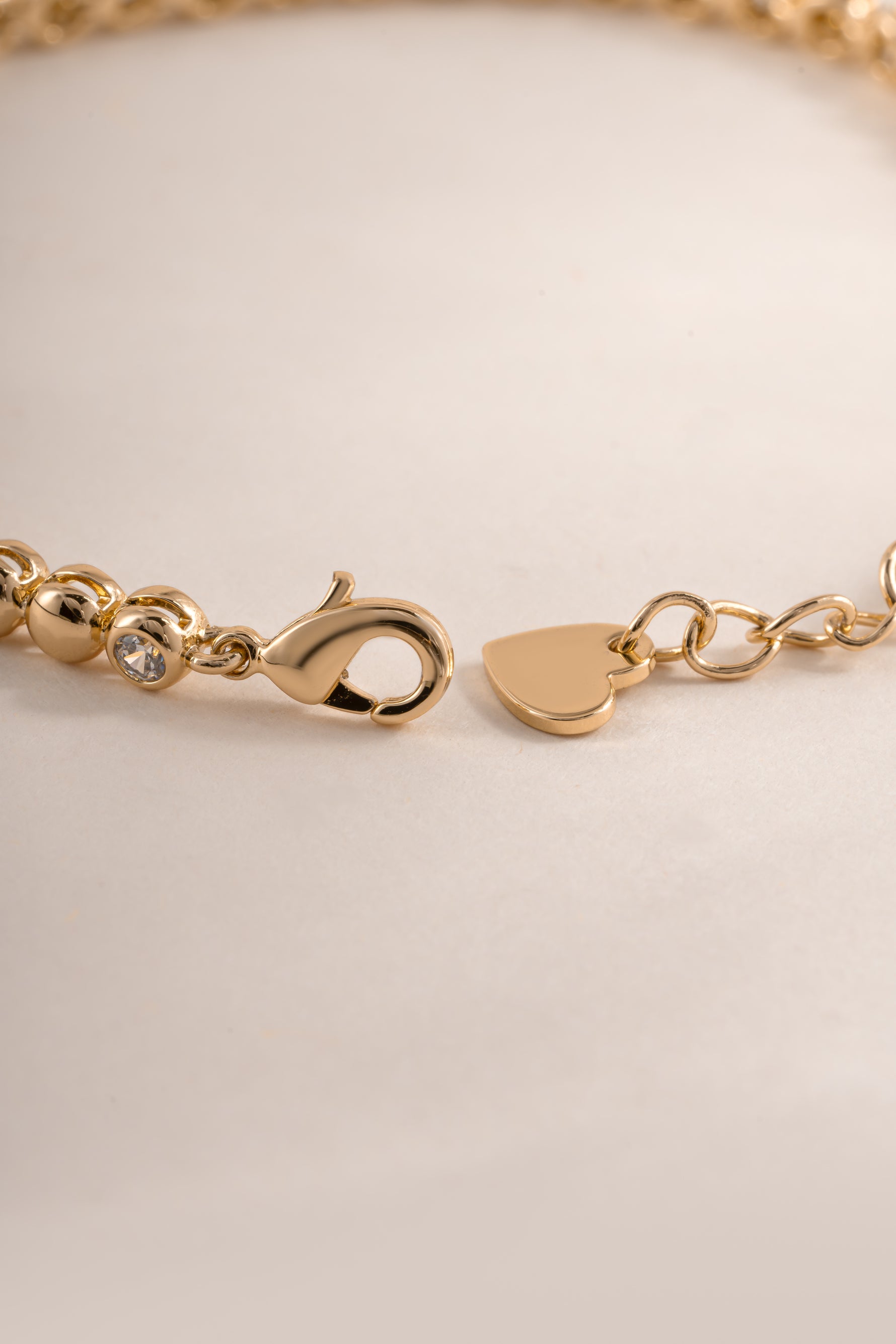 Sami Jewels bead and bezel tennis bracelet with lobster clasp closure, featuring sparkling beads and elegant design.
