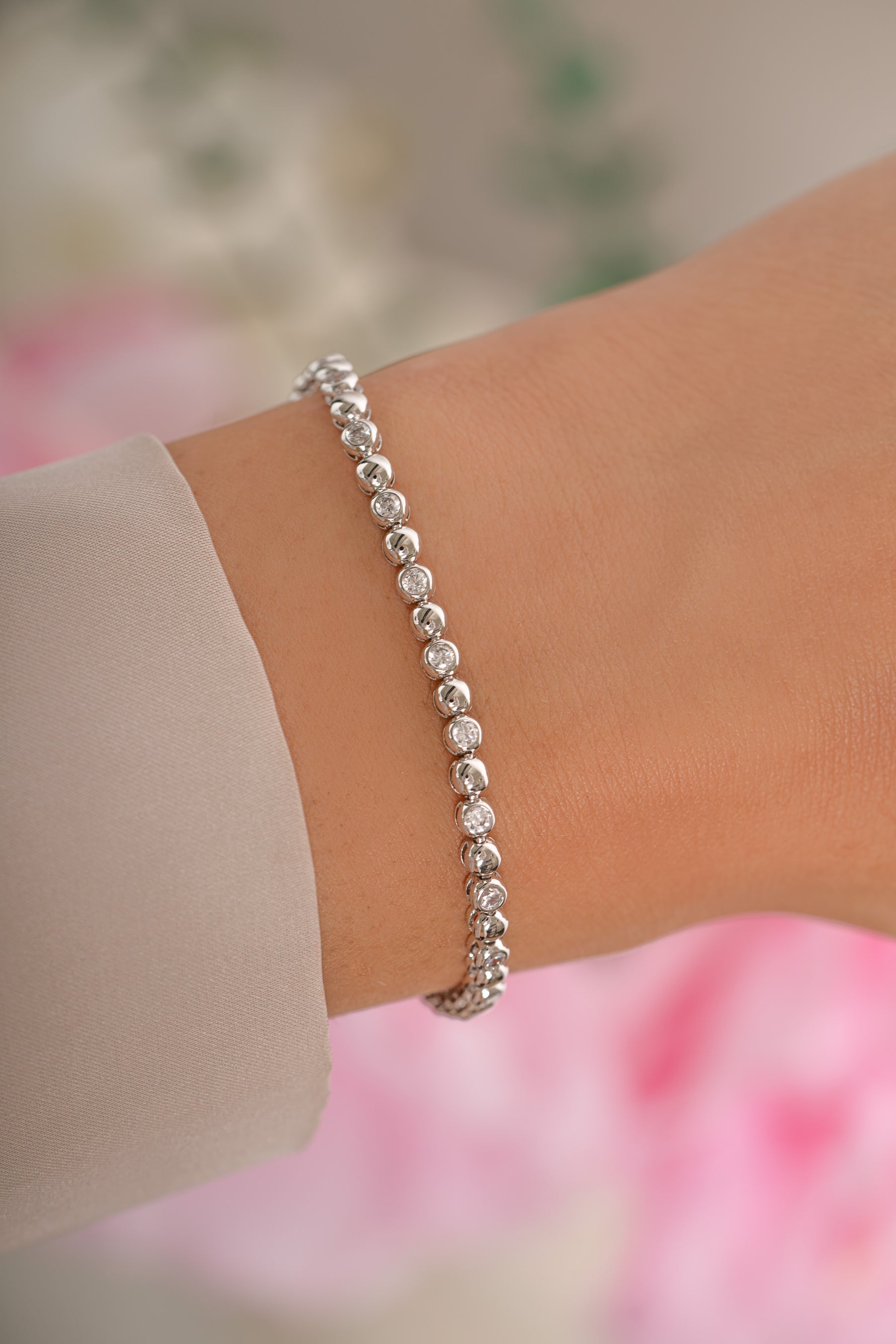 Silver bead and bezel tennis bracelet by Sami Jewels featuring a delicate chain and sparkling accents.