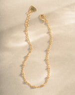 Gold beaded bracelet by Sami Jewels featuring simple, elegant beads for a stylish accessory.