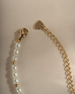 Beaded pearl necklace by Sami Jewels featuring gold beads and a lobster clasp closure, elegant jewelry accessory for formal wear.