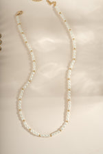 Gold beaded pearl necklace by Sami Jewels featuring elegant pearl and bead design for sophisticated jewelry style.