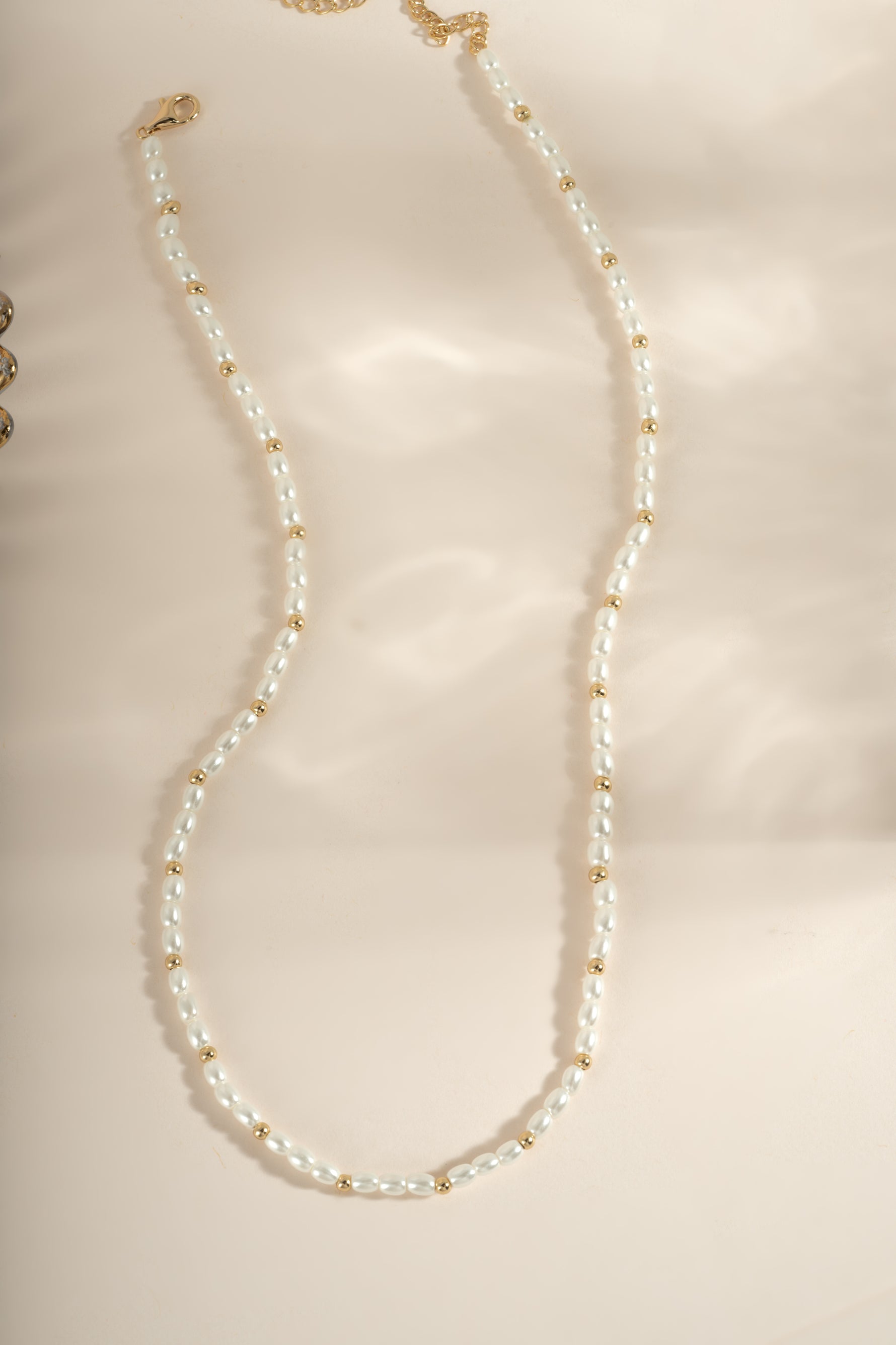 Gold beaded pearl necklace by Sami Jewels featuring elegant pearl and bead design for sophisticated jewelry style.