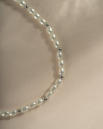 Sterling silver beaded pearl necklace from Sami Jewels featuring elegant, round pearls on a delicate chain.