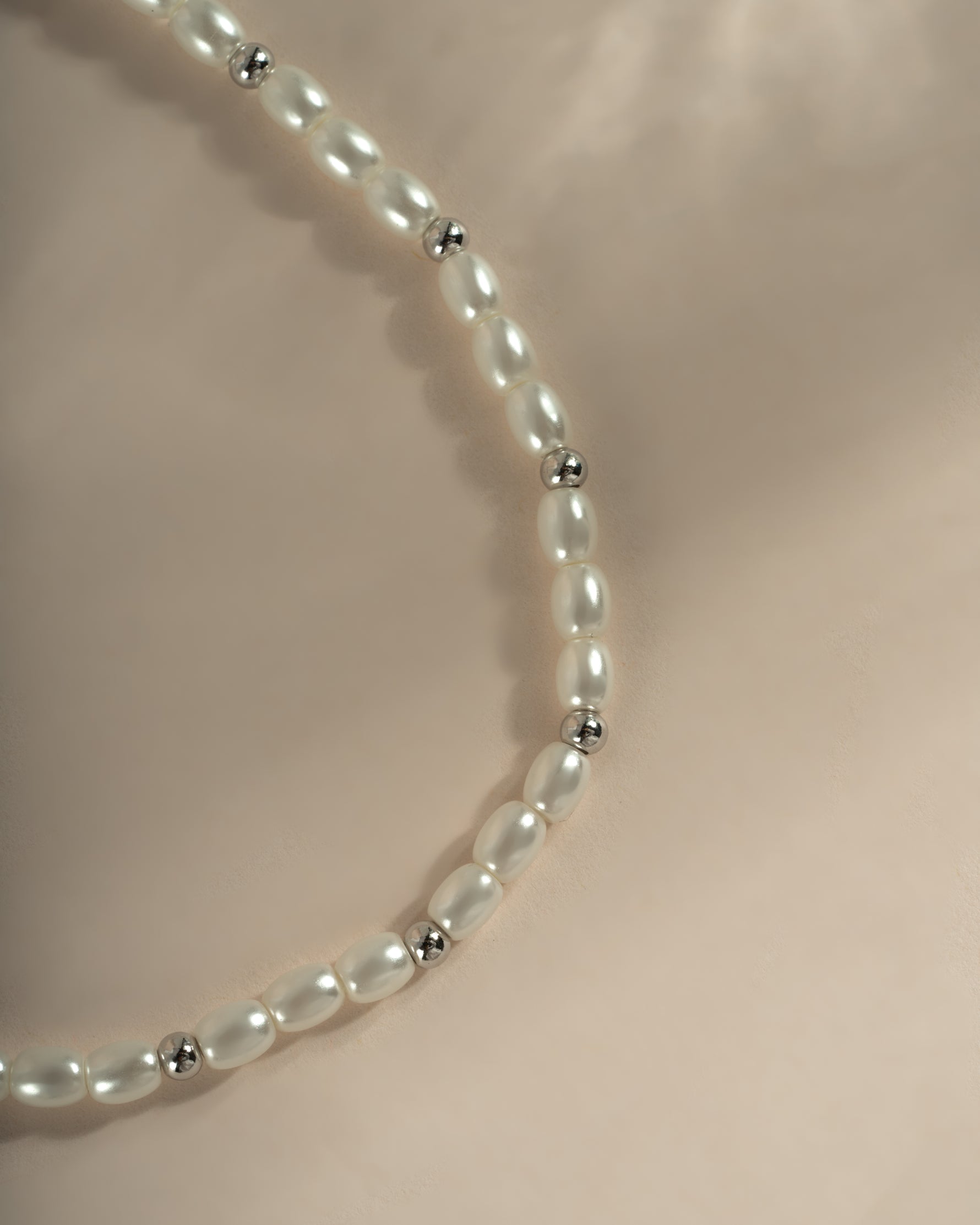 Sterling silver beaded pearl necklace from Sami Jewels featuring elegant, round pearls on a delicate chain.