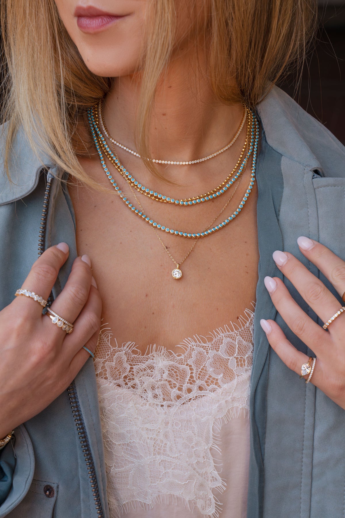 Gold turquoise and CZ tennis necklaces layered with a CZ bezel pendant necklace