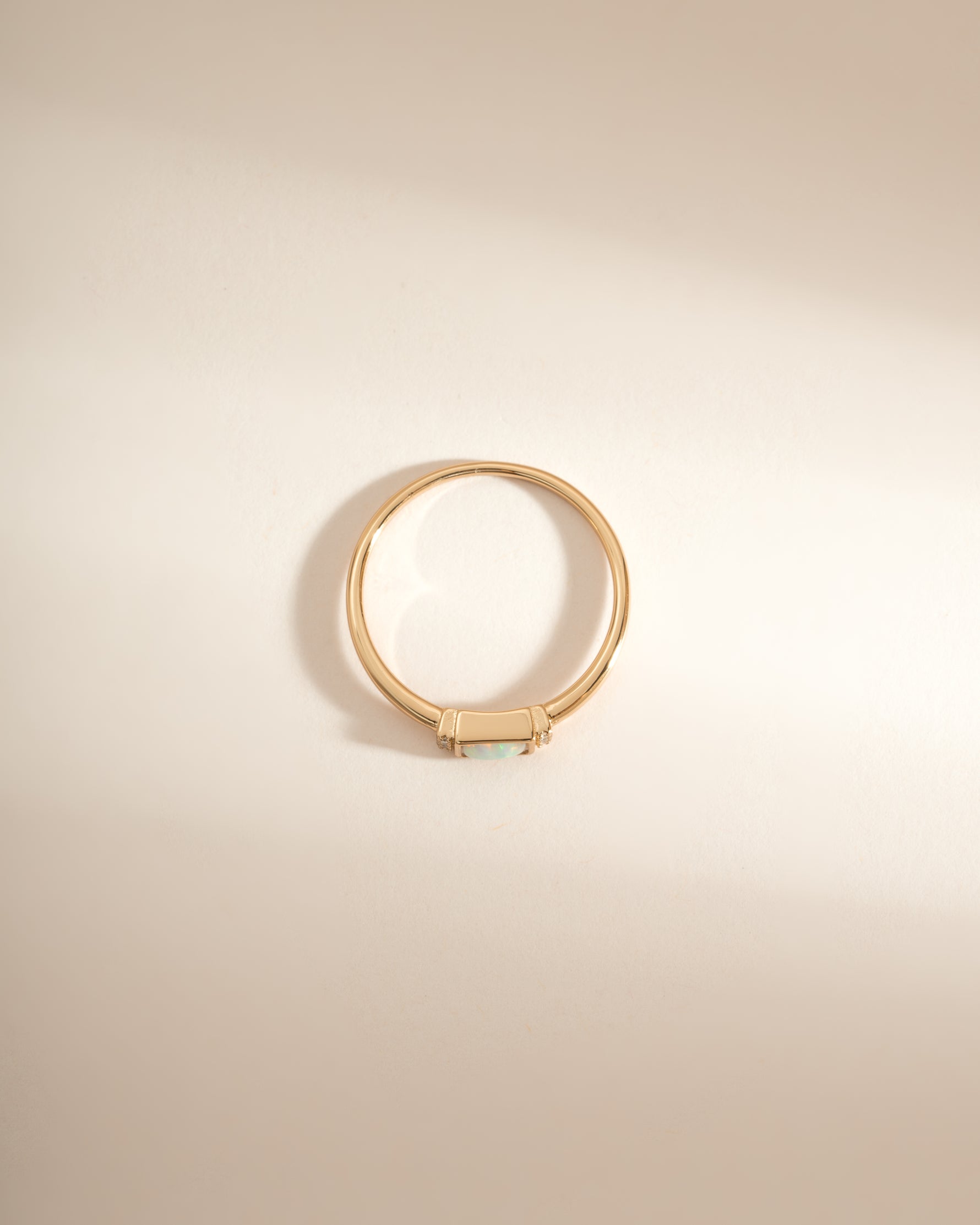 Gold bezel Baguette Opal Ring by Sami Jewels, top view showcasing the rectangular opal gemstone set in a sleek gold band.