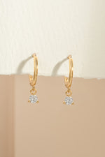 Gold bezel charm huggie earrings by Sami Jewels featuring small, stylish hoop design with decorative charm details.