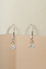 Sterling silver Bezel Charm Huggie earrings by Sami Jewels, featuring small hoop design with decorative bezel charms.