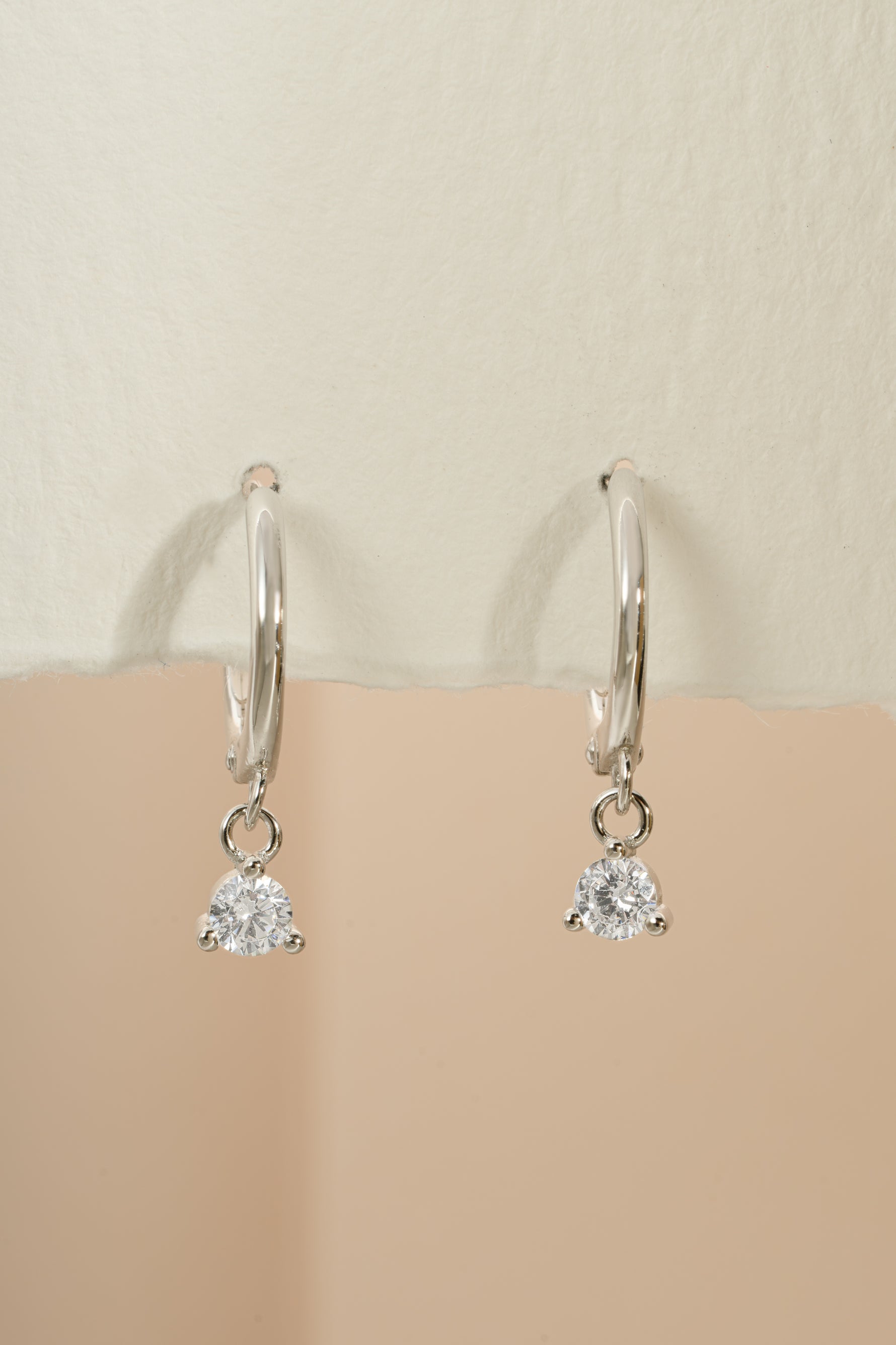 Sterling silver Bezel Charm Huggie earrings by Sami Jewels, featuring small hoop design with decorative bezel charms.