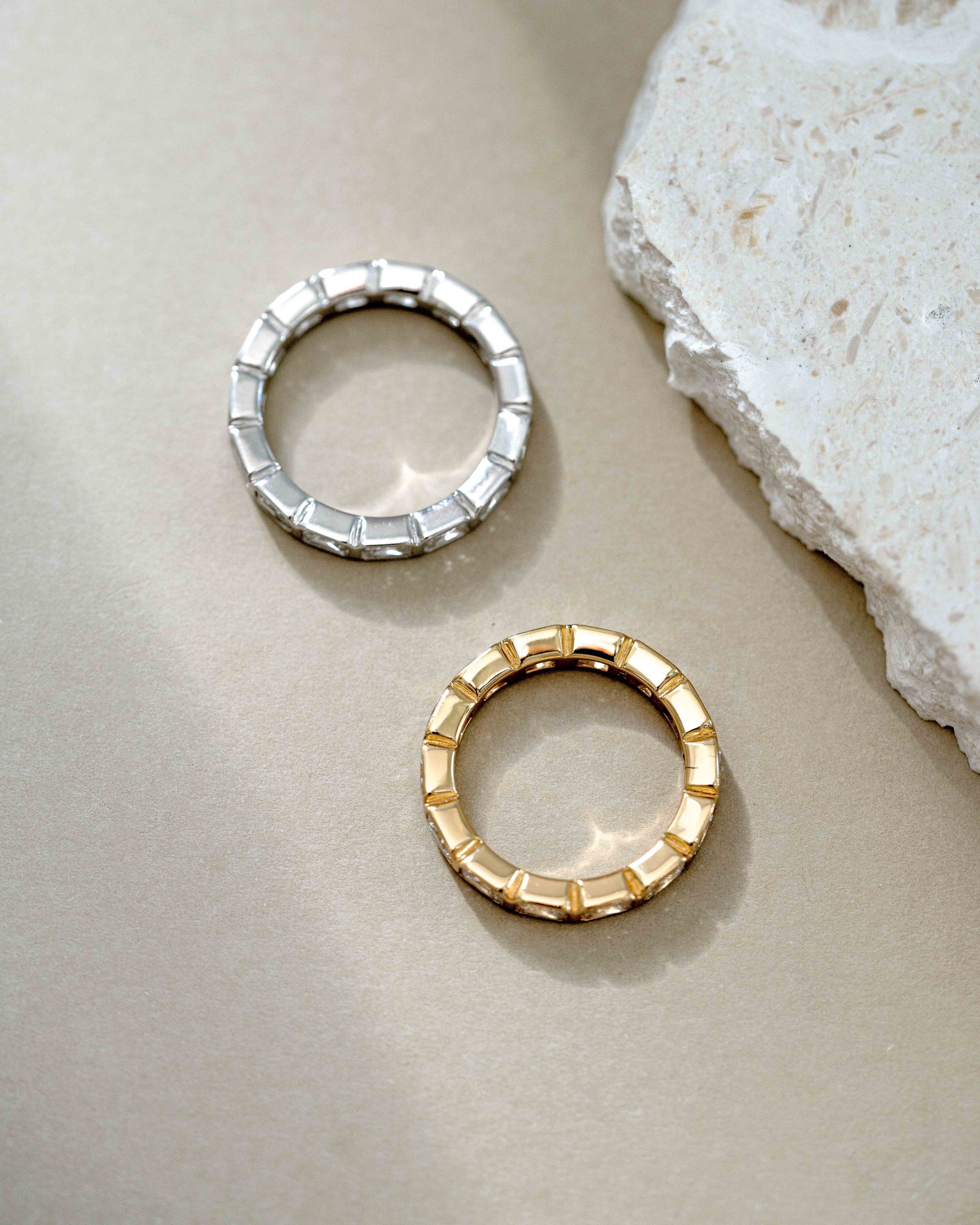 Sami Jewels bezel emerald cut eternity band ring in gold and sterling silver with a sleek, modern design.