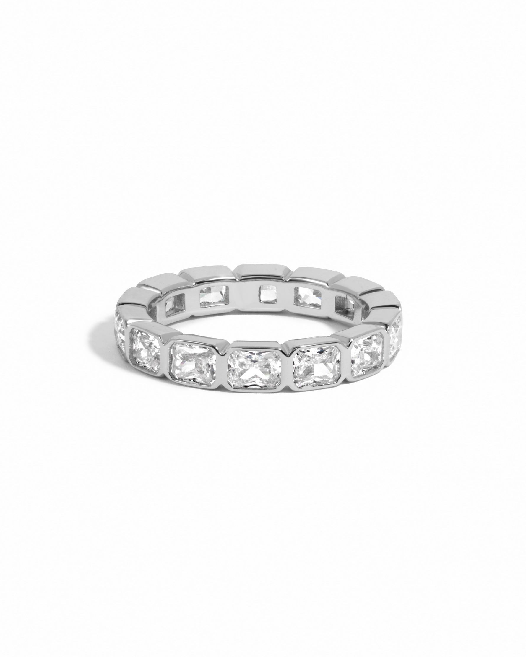 Sterling silver bezel emerald cut eternity ring from Sami Jewels with a sleek, modern design on a white background.