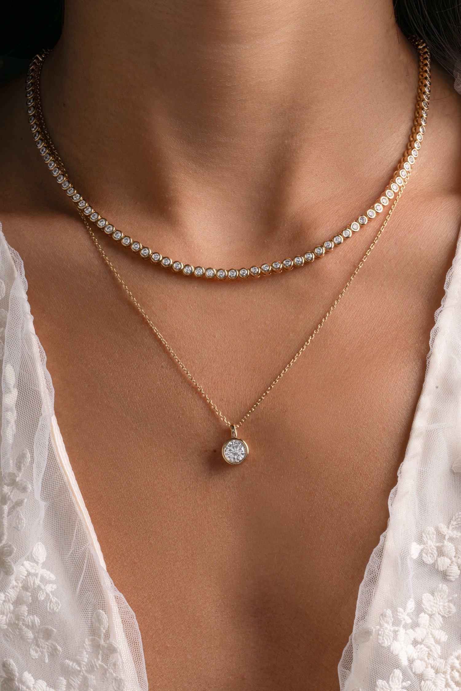 Gold round bezel necklace from Sami Jewels, featuring a sleek circular pendant on a delicate chain.