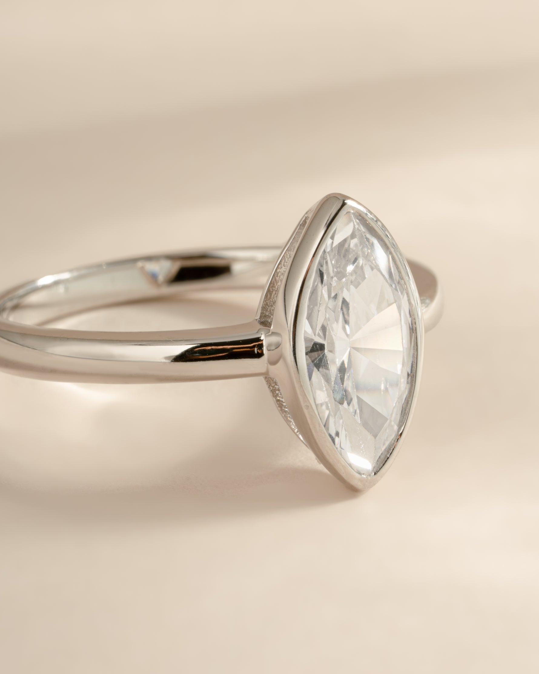 Sterling silver Bezel Marquise Ring with a bezel-set cubic zirconia stone, designed by Sami Jewels.